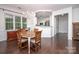 Elegant dining room with hardwood floors and a chandelier, perfect for gatherings at 18439 Victoria Bay Dr, Cornelius, NC 28031