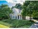 Beautiful home exterior with lush landscaping, offering great curb appeal at 18439 Victoria Bay Dr, Cornelius, NC 28031