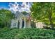 Charming home featuring manicured landscaping and a welcoming front porch at 18439 Victoria Bay Dr, Cornelius, NC 28031