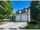 Spacious two-car garage with an inviting exterior and well-maintained driveway at 18439 Victoria Bay Dr, Cornelius, NC 28031