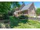 Large backyard with patio, grill, and lush landscaping, perfect for outdoor entertaining at 18534 Carnegie Overlook Blvd # 110, Davidson, NC 28036