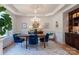 Bright dining room featuring large window, stylish lighting, and elegant decor at 18534 Carnegie Overlook Blvd # 110, Davidson, NC 28036