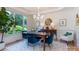 Bright dining room featuring large window, stylish lighting, and elegant decor at 18534 Carnegie Overlook Blvd # 110, Davidson, NC 28036