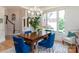 Bright dining room featuring large window, stylish lighting, and elegant decor at 18534 Carnegie Overlook Blvd # 110, Davidson, NC 28036