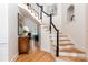 Elegant entryway with staircase, hardwood floors, and view into living room at 18534 Carnegie Overlook Blvd # 110, Davidson, NC 28036