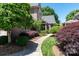 Inviting walkway to the front door, lined with beautiful landscaping at 18534 Carnegie Overlook Blvd # 110, Davidson, NC 28036