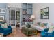 Bright living room showcasing the built-in bookshelves, light wood flooring and comfortable seating at 18534 Carnegie Overlook Blvd # 110, Davidson, NC 28036