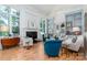 Spacious living room with fireplace, large windows, and hardwood flooring at 18534 Carnegie Overlook Blvd # 110, Davidson, NC 28036