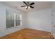 Bright bedroom with hardwood floors, natural light, and ceiling fan at 18730 Nautical Dr # 102, Cornelius, NC 28031