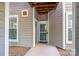 Ground level condo entrance featuring unit number and protected entry way at 18730 Nautical Dr # 102, Cornelius, NC 28031