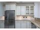 Kitchen showcasing stainless steel refrigerator, granite countertops, and ample cabinet space at 18730 Nautical Dr # 102, Cornelius, NC 28031