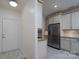 Open kitchen with stainless steel refrigerator, and ample cabinet space at 18730 Nautical Dr # 102, Cornelius, NC 28031
