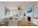 Bright living room boasts a fireplace, ceiling fan, and sliding doors to the outdoors at 18730 Nautical Dr # 102, Cornelius, NC 28031