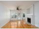 Bright living room with hardwood floors and fireplace; natural light throughout at 18730 Nautical Dr # 102, Cornelius, NC 28031