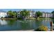 Beautiful pond view featuring a fountain, surrounded by well-maintained condos and green landscaping, providing a serene ambiance at 18730 Nautical Dr # 102, Cornelius, NC 28031