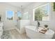 This modern bathroom has a glass shower, a freestanding tub, and sleek fixtures at 19 Berea Baptist Church Rd, Stanfield, NC 28163