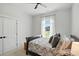 This bedroom features a decorative ceiling fan, a window, and neutral décor at 19 Berea Baptist Church Rd, Stanfield, NC 28163