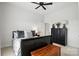This bedroom features hardwood floors, neutral décor, and an attached bathroom at 19 Berea Baptist Church Rd, Stanfield, NC 28163