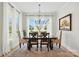 Bright dining room boasts ample natural light, stylish chandelier, and comfortable seating for memorable gatherings at 19 Berea Baptist Church Rd, Stanfield, NC 28163