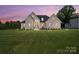 Charming brick home with a manicured lawn and professionally landscaped yard; a welcoming sight for prospective buyers at 19 Berea Baptist Church Rd, Stanfield, NC 28163