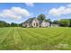 Sprawling lawn showcases the home's desirable location and picturesque surroundings at 19 Berea Baptist Church Rd, Stanfield, NC 28163