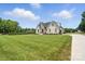 Home has mature trees and a well-manicured lawn, showcasing the property's desirable location at 19 Berea Baptist Church Rd, Stanfield, NC 28163