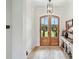 Inviting foyer with a statement door and stylish decor offers a warm welcome at 19 Berea Baptist Church Rd, Stanfield, NC 28163