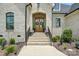The front door, brick archway, and steps create an inviting approach at 19 Berea Baptist Church Rd, Stanfield, NC 28163