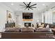 Spacious living room features a fireplace, large TV, ceiling fan and comfortable seating, perfect for relaxing and entertaining at 19 Berea Baptist Church Rd, Stanfield, NC 28163