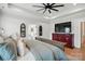 This main bedroom features hardwood floors, white walls, and an attached bathroom at 19 Berea Baptist Church Rd, Stanfield, NC 28163