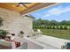 Covered patio featuring an outdoor seating area, wood ceiling, brick exterior and backyard at 19 Berea Baptist Church Rd, Stanfield, NC 28163