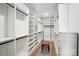 This walk-in closet has built-in shelves, ample storage space, and hardwood floors at 19 Berea Baptist Church Rd, Stanfield, NC 28163