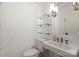 Bright bathroom with a sink, toilet, and tile walls at 2015 Lombardy Cir, Charlotte, NC 28203