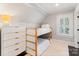 Cozy bedroom features bunkbeds, carpeted floors, and a white dresser at 2015 Lombardy Cir, Charlotte, NC 28203