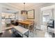 Bright dining room with wooden table, stylish chandelier and seamless transition to other living areas at 2015 Lombardy Cir, Charlotte, NC 28203
