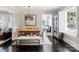 Cozy dining room with wood table, stylish lighting, and seamless transition to additional living spaces at 2015 Lombardy Cir, Charlotte, NC 28203