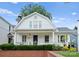Charming two-story home featuring a classic design, inviting front porch and beautifully landscaped yard at 2015 Lombardy Cir, Charlotte, NC 28203