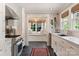 Modern kitchen with stainless steel appliances, tile backsplash, and a charming window seat at 2015 Lombardy Cir, Charlotte, NC 28203