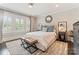 Luxurious main bedroom features soft textures, natural light and leather benches at 2015 Lombardy Cir, Charlotte, NC 28203