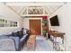 Finished shed interior, complete with electric, mini-split HVAC, TV, and hardwood floors at 2015 Lombardy Cir, Charlotte, NC 28203