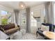 Bright and inviting sunroom with large windows, comfortable seating, and stylish decor at 2015 Lombardy Cir, Charlotte, NC 28203