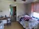 Bedroom shows bed covered with American flag and decor with doorway to kitchen visible at 212 Huffman Rd, Gastonia, NC 28052