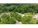 Scenic aerial view of a townhouse nestled amongst lush trees and greenery creating a peaceful neighborhood setting at 2137 Whispering Way, Charlotte, NC 28212