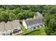 Aerial view of the homes show the backyard, green grass, patio and fenced in backyard space at 2137 Whispering Way, Charlotte, NC 28212