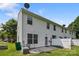 The home has a concrete backyard patio with access to home, air conditioning unit, and white vinyl fence at 2137 Whispering Way, Charlotte, NC 28212