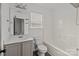 Well-lit bathroom featuring a vanity, toilet, and bathtub with shower at 2137 Whispering Way, Charlotte, NC 28212