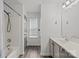 Bright bathroom featuring modern fixtures, vanity, and shower-tub combo at 2137 Whispering Way, Charlotte, NC 28212