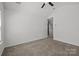 Spacious bedroom with carpeted flooring, ceiling fan and neutral wall paint at 2137 Whispering Way, Charlotte, NC 28212