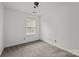 Comfortable bedroom with carpeting, a window, and natural lighting at 2137 Whispering Way, Charlotte, NC 28212