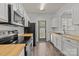 Well-equipped kitchen with white cabinets, butcher block countertops, and stainless steel appliances at 2137 Whispering Way, Charlotte, NC 28212